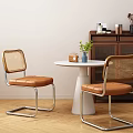 White Round Dining Table with Two Rattan Back Chairs Leather Seats and Cabinet Decorations