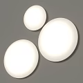 Three White Round Illuminated Wall Lights Mounted on Gray Background Wall 3d model