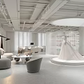 Elegant Bridal Shop Interior Featuring Wedding Dress Display Platform And Modern Furniture
