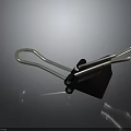 Black Binder Clip Office Supply With Sturdy Silver Metal Arms And Plastic Body