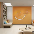 Relaxing Lounge Area With Orange Wall Smiley Face Design Bookshelves Benches Pillows Round Coffee Table