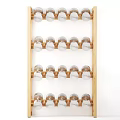 Decorative Wooden Shelf With Multiple Layers Holding Silver And Gold Spheres