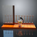 Small Cat Doll On Wooden Platform With Glass Partition And Metal Railing