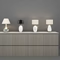 Four Modern Table Lamps on Wooden Cabinet with Drawers and White Black Shades