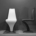 Modern White and Black Accent Chairs with Sleek Curved Lines in Interior