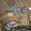 Round Wooden Hut With Thatch Roof Surrounded By Palm Trees And Natural Setting