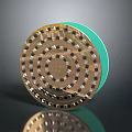 Circular Gold Household Item With Green Edge And Decorative Surface Dots