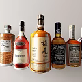 Display of Various Branded Liquor Bottles Featuring Hennessy Jack Daniels and Other Labels Arranged