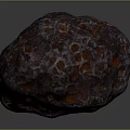 Dark Colored Natural Stone With Red Glowing Spots And Intricate Surface Texture