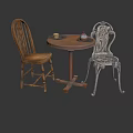 Round Wooden Table With Two Chairs One Wooden And One Ornate Metal With Plates