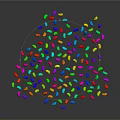 Colorful Waterdrop Shaped Particles Forming Irregular Shape On Black Background With Reflection