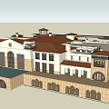Traditional European Hotel Building With Red Roof White Walls Arched Windows And Courtyard