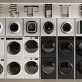 Various Front Loading Washing Machines With White And Black Modern Designs Arranged In Rows 3d model