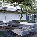 Modern Courtyard Garden with Gray Sofas Coffee Tables Trees Greenery and White Wall Design