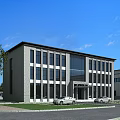 Large Industrial Factory Building With Flat Roof Surrounded by Greenery Roads and Entrance Area