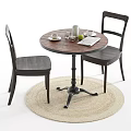 Round Wooden Table And Chairs Set With Coffee Cup Cookie And Woven Rug