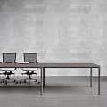 Modern Conference Table with Brown Top Black Legs and Mesh Office Chairs in Gray Concrete