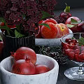 Fresh Ripe Red Apples Cherries Peaches And Pomegranate With Purple Flowers And Fresh Leaves