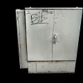 Weathered White Metal Cabinet With BB Graffiti On Door And Rustic Exterior