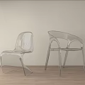 Transparent Curved Leisure Chairs in Light Wall and Wooden Floor Interior