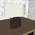 Modern Table Lamp With Cream Lampshade And Black Base On Wooden Table Near Geometric Art