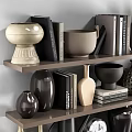 Modern Ceramic Vessels And Decorative Pieces On Shelves With Books And Various Styles