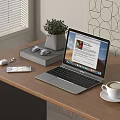 Open Silver Laptop on Wooden Desk with Coffee Mouse Notebook and Green Plant