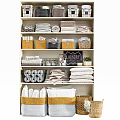 Storage Shelf Unit with Folded Towels Baskets Laundry Sign and Potted Plant