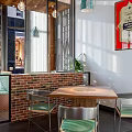 Modern Restaurant Interior With Brick Partition Wooden Table Metal Chairs And Green Plants