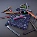 Colorful Crayons Scattered Around Open Box With CRAYONS Text On Cover