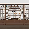 Chinese Style Display Cabinet With Circular Openwork Shelves Holding Tea Sets Books And Decorative Items