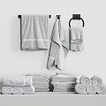 Soft Light Gray Cotton Bath Hand Towels Hung On Wall Rack Rolled On Shelf