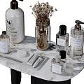 Essential Bathroom Accessories On Marble Countertop With Soap Dispensers Fragrance Bottles And Dried Flowers
