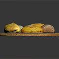 Fresh Homemade Bread Varieties on Wicker Tray With Different Shapes and Colors