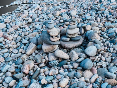 Colorful Natural Stone And Wood Pebbles Stacked By Water Edge For Decoration 3d model