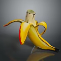 Peeled Banana with Yellow Skin Red Edges and Wooden Stem on Dark Shiny Surface