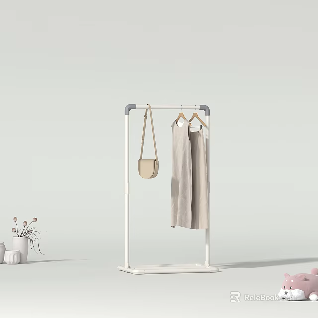 White Floor Standing Hanger In Home Interior With Beige Pants Beige Bag And Decorations 3d model 