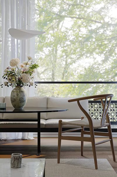Modern Restaurant Interior With Vase Of Flowers Sofa Wooden Chair And Green Window View 3d model