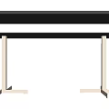 Stylish Black Console Table With Metal Legs On Wooden Floor Against Textured Wall