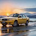 Yellow Taxi Car Parked On Beach At Sunset With Mountain And Water Reflection