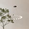 Circular Pendant Light With White Bulbs Hanging Over Green Plants On Light Wall Background
