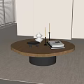 Round Wooden Top Coffee Table With Black Base White Ornament Candles And Books