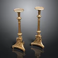 Elegant Pair Of Golden Candlesticks With Carved Base And Ornate Design