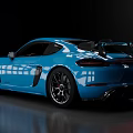 Blue Shiny Sports Car With Sporty Design Rear Spoiler And Alloy Wheels