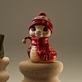 Red Snake Shaped Art Installation With Knitted Hat Scarf And Gold Patterns On Wooden Base