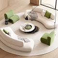 Modern Curved White Sofa with Green Armchairs and Round Coffee Table Set on Rug