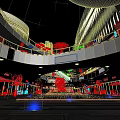 Modern Commercial Street With Multistory Buildings Shops Water Feature And Night Lighting