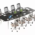 Black Conference Table With Wheeled Office Chairs Green Plants Laptop Documents And Tissue Box