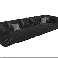 Black Sectional Sofa with Multiple Black Cushions and White Accent Pillows in Modern Leather Design