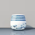 Succulent Plant in Blue and White Ceramic Pot with Wave Pattern on Gray Surface